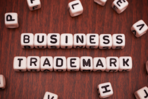 Scrabble pieces that spell out business trademark